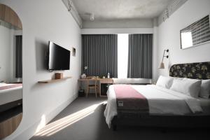 Letto o letti in una camera di Hotel Monopoli