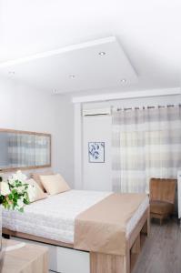 Postel nebo postele na pokoji v ubytování Cozy home in Thessaloniki center