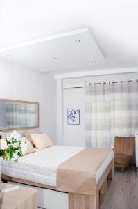 Posteľ alebo postele v izbe v ubytovaní Cozy home in Thessaloniki center