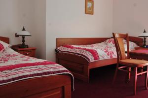 Posteľ alebo postele v izbe v ubytovaní Hotel Pegas Brno