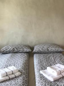 two beds sitting next to each other in a bedroom at The Little Room in Bovec