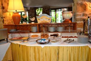 a table with a buffet of food on it at Hotel Danila in Portoferraio