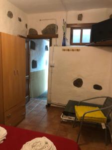 Posteľ alebo postele v izbe v ubytovaní La Piedra Viva Agüimes , Siete hermanos