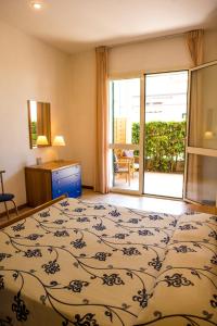 מיטה או מיטות בחדר ב-Riviera Residence