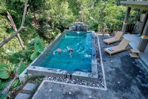 Bazén v ubytování Gek House Ubud Bali nebo v jeho okolí