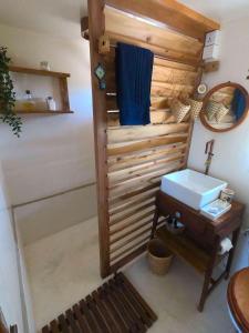 a bathroom with a toilet and a sink and a mirror at Memo's Beach in Nilaveli