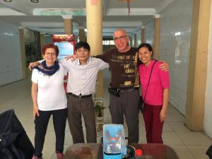 a group of three people posing for a picture at Tam Cốc mountain view Villa in Ninh Binh