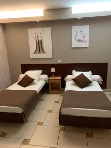 Postel nebo postele na pokoji v ubytování Hôtel restaurant Mon Auberge