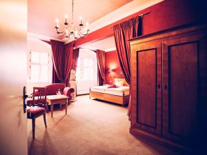 Voodi või voodid majutusasutuse Trip Inn Hotel Der Adelshof toas