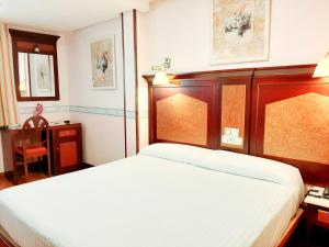 Postel nebo postele na pokoji v ubytování Hosteria Sara by gaiarooms