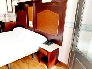 Postel nebo postele na pokoji v ubytování Hosteria Sara by gaiarooms