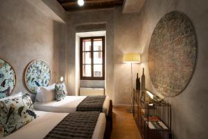 Palm Suites - Small Luxury Hotels of the World客房内的一张或多张床位