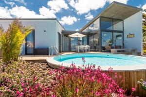 a home with a swimming pool and a house at BLUE Casa by VILLA HAHN in Puntagorda
