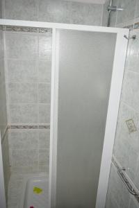 a shower with a glass door in a bathroom at I Ragazzi del Borghetto in Marina di Schiavonea