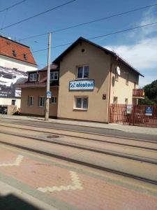 a building with a sign on the side of a street at Ubytování Mája in Liberec