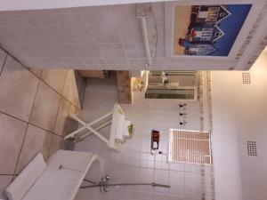 an overhead view of a bathroom with a toilet at Belurana River Manor in Upington