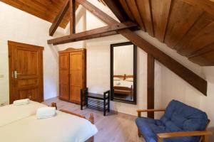 Voodi või voodid majutusasutuse Domaine du Moulin d'Asselborn toas