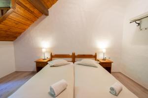 Voodi või voodid majutusasutuse Domaine du Moulin d'Asselborn toas