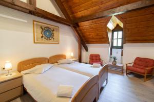 Voodi või voodid majutusasutuse Domaine du Moulin d'Asselborn toas