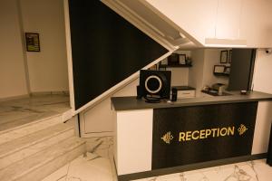 a reception desk with a speaker on top of it at PAPİLLONADA HOTEL in Aydın