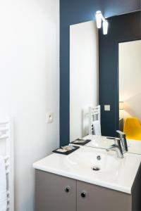 Koupelna v ubytování Ténéo Apparthotel Bordeaux - Gare Saint Jean