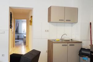 Kjøkken eller kjøkkenkrok på Work & Stay Apartment