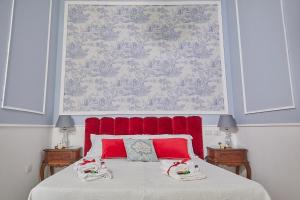 A bed or beds in a room at Il Piccolo Principe Affittacamere