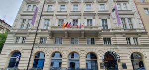 a building with flags on top of it at Michelangelo Grand Hotel in Prague