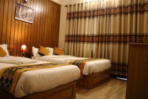 Postel nebo postele na pokoji v ubytování Kathmandu Peace Guesthouse