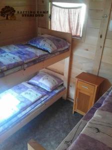 a room with two bunk beds in a cabin at Rafting Campsite Stari Dud in Foča