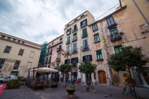 a group of buildings on a city street at Glam House Apartment in Salerno