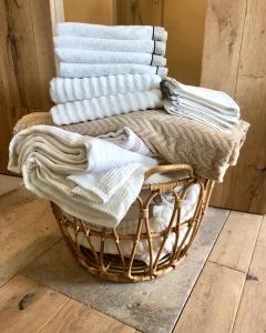 a basket with blankets and towels on top of it at The Little Room in Bovec