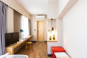 Televízia a/alebo spoločenská miestnosť v ubytovaní St. Bjur Suites