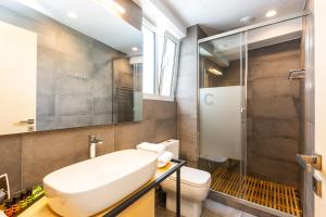 a bathroom with a sink and a toilet and a shower at St. Bjur Suites in Athens +38 photos