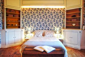 מיטה או מיטות בחדר ב-Manoir de la Blondellerie