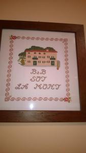 a picture frame with a picture of a building at Sot la Mont in Cividale del Friuli