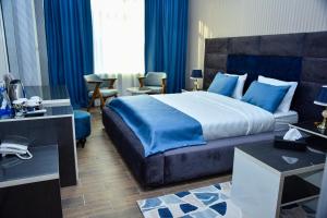 Postel nebo postele na pokoji v ubytování Supreme Hotel Baku