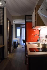 a kitchen with a sink and a counter top at Q Luxury Rooms in Thessaloniki +121 photos