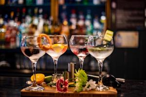 four glasses of wine sitting on a bar at Midlands Park Hotel in Portlaoise