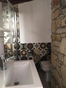 a bathroom with a sink and a toilet at The Stone Castle Boutique Hotel in Ağaçlı +83 photos