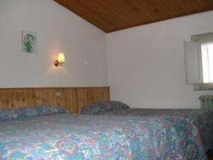 Postel nebo postele na pokoji v ubytování Albergo Le Rose