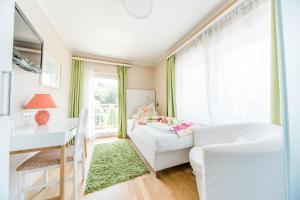 מיטה או מיטות בחדר ב-Hotel St. Hubertushof