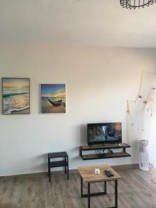 TV a/nebo společenská místnost v ubytování Sunrise view + 21 fotografií