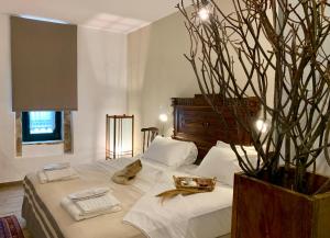 Posteľ alebo postele v izbe v ubytovaní Villa Vager Mani Hotel