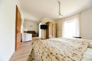 מיטה או מיטות בחדר ב-Hotel St. Hubertushof