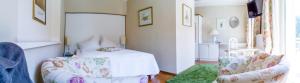 מיטה או מיטות בחדר ב-Hotel St. Hubertushof