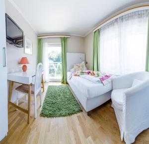 מיטה או מיטות בחדר ב-Hotel St. Hubertushof