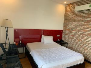 Postel nebo postele na pokoji v ubytování Gia Huyền Hotel