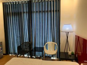 Postel nebo postele na pokoji v ubytování Gia Huyền Hotel