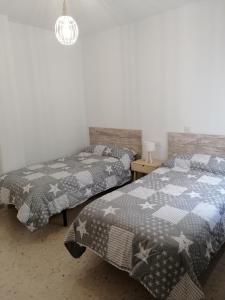 Een bed of bedden in een kamer bij Sueños Mozárabes